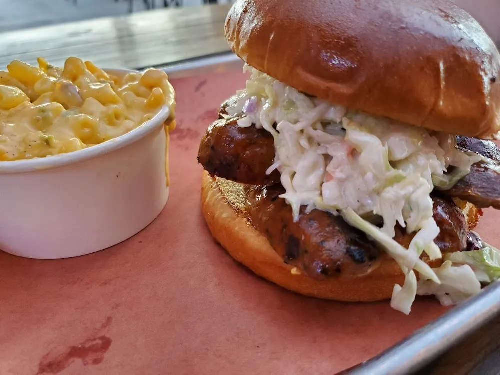 Jalapeño Cheddar Sausage Sandwich with Added Coleslaw and a Side of Jalapeño Mac & Cheese